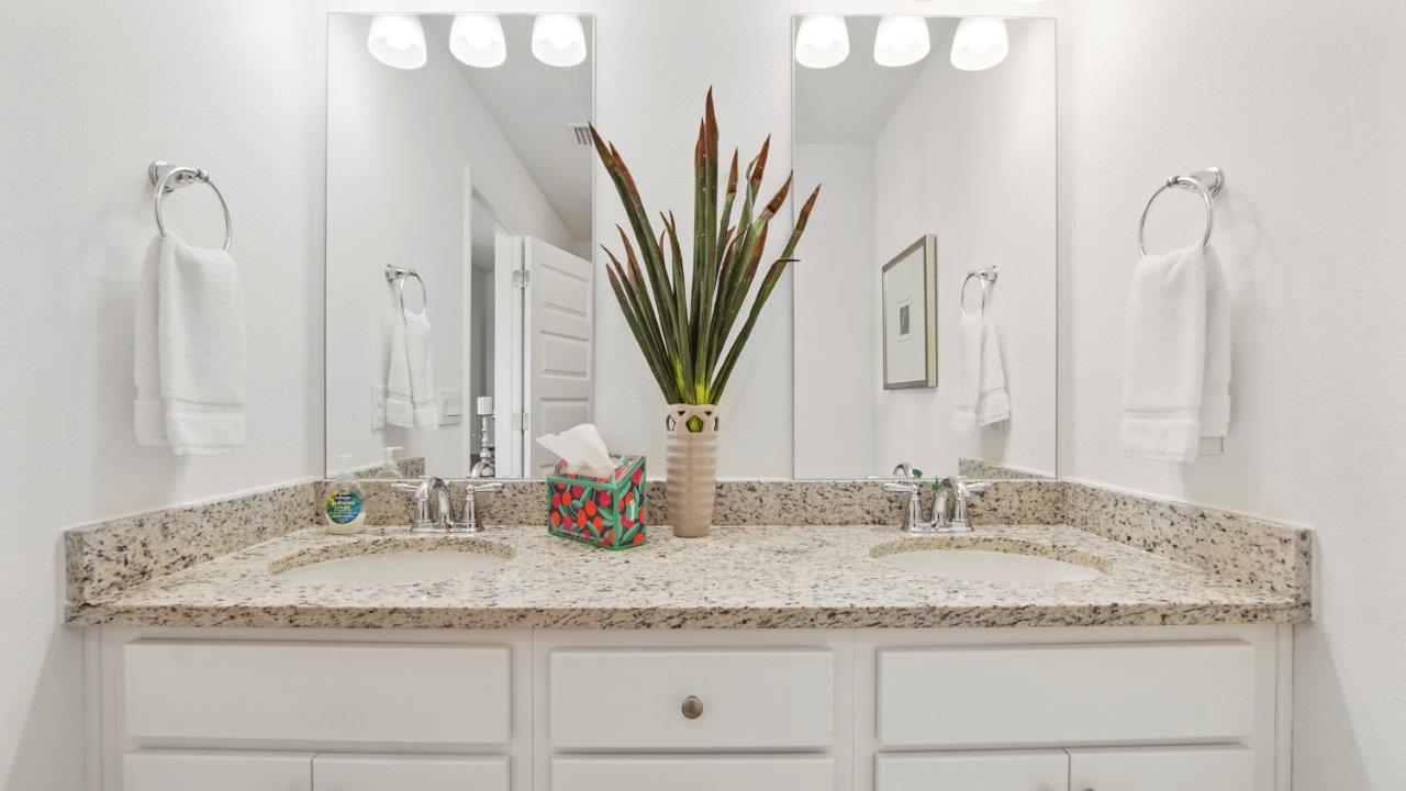 Functional full bath offering a tub/shower combo and easy to maintain surfaces.