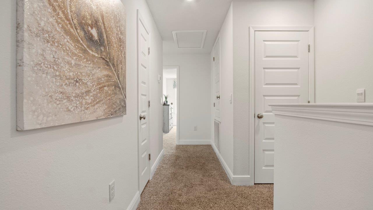 Bright primary bathroom with quartz countertops, and a standalone shower, and a walk in closet.