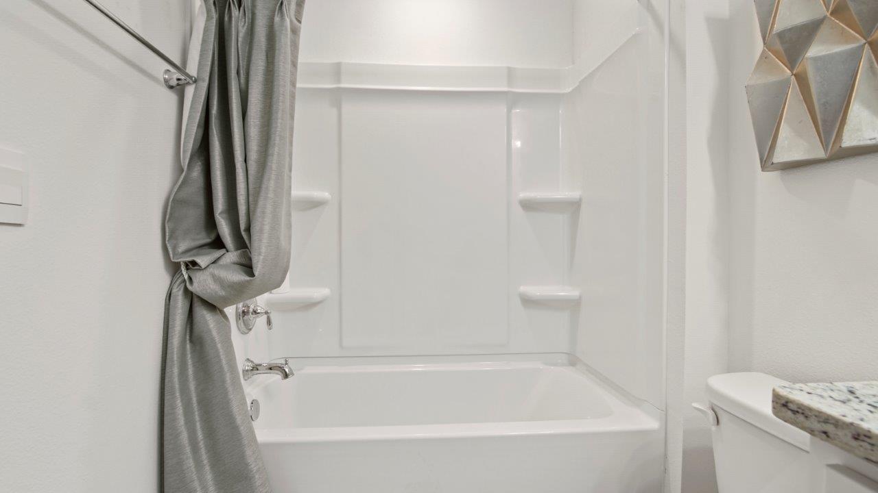 Full bathroom with a convenient tub/shower combo and clean, modern finishes.