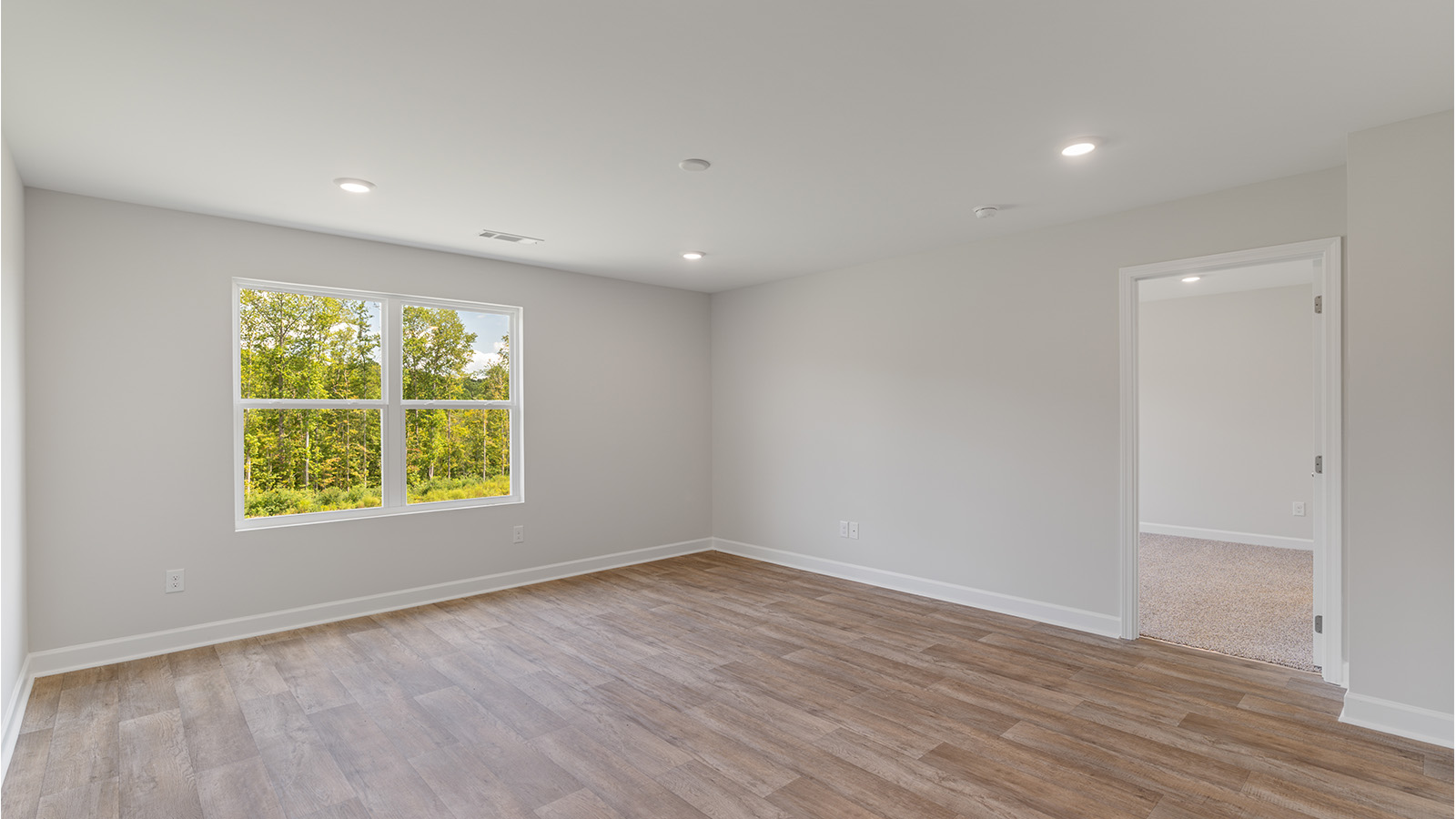 Spacious living room designed for entertaining with an open floorplan.