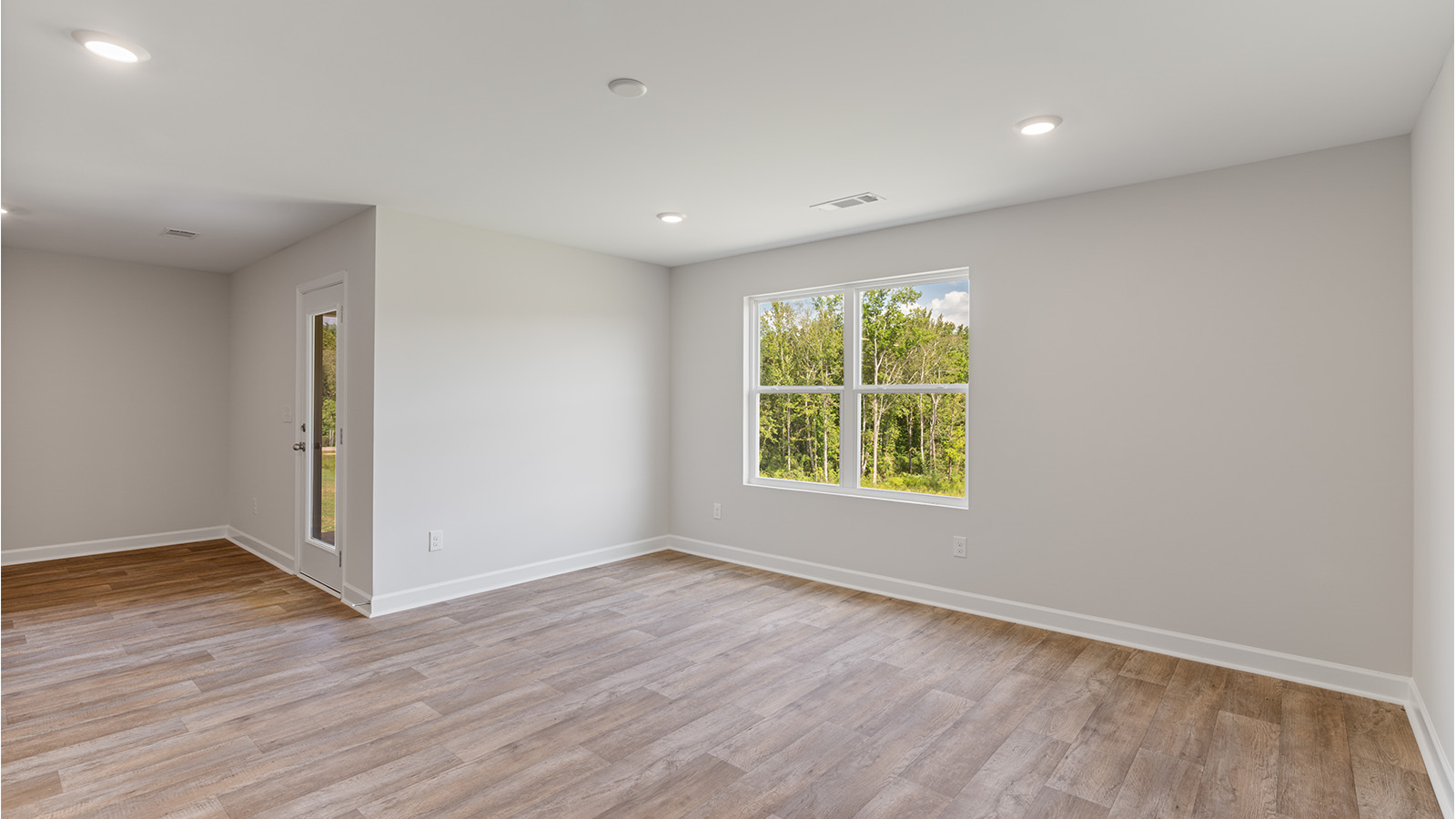 Spacious living room designed for entertaining with an open floorplan.