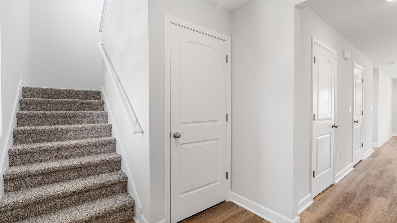 Belfort floorplan with quartz counter tops,, open concept living, and lvp flooring in all wet areas