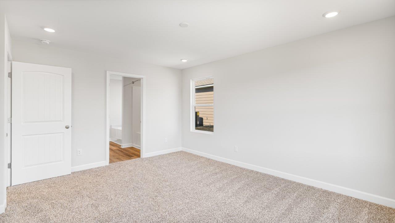 Belfort floorplan with quartz counter tops,, open concept living, and lvp flooring in all wet areas