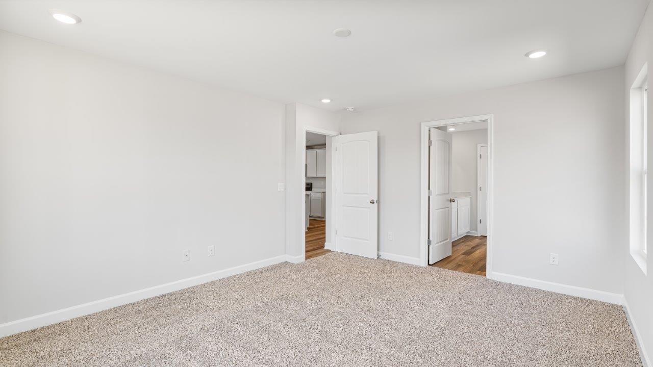 Belfort floorplan with quartz counter tops,, open concept living, and lvp flooring in all wet areas