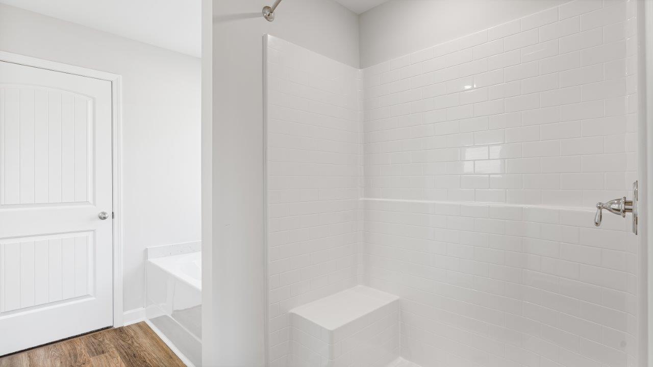 Belfort floorplan with quartz counter tops,, open concept living, and lvp flooring in all wet areas