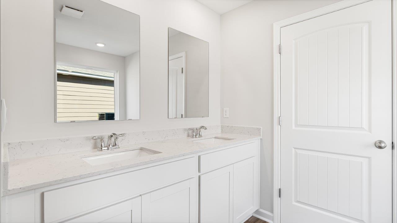 Belfort floorplan with quartz counter tops,, open concept living, and lvp flooring in all wet areas