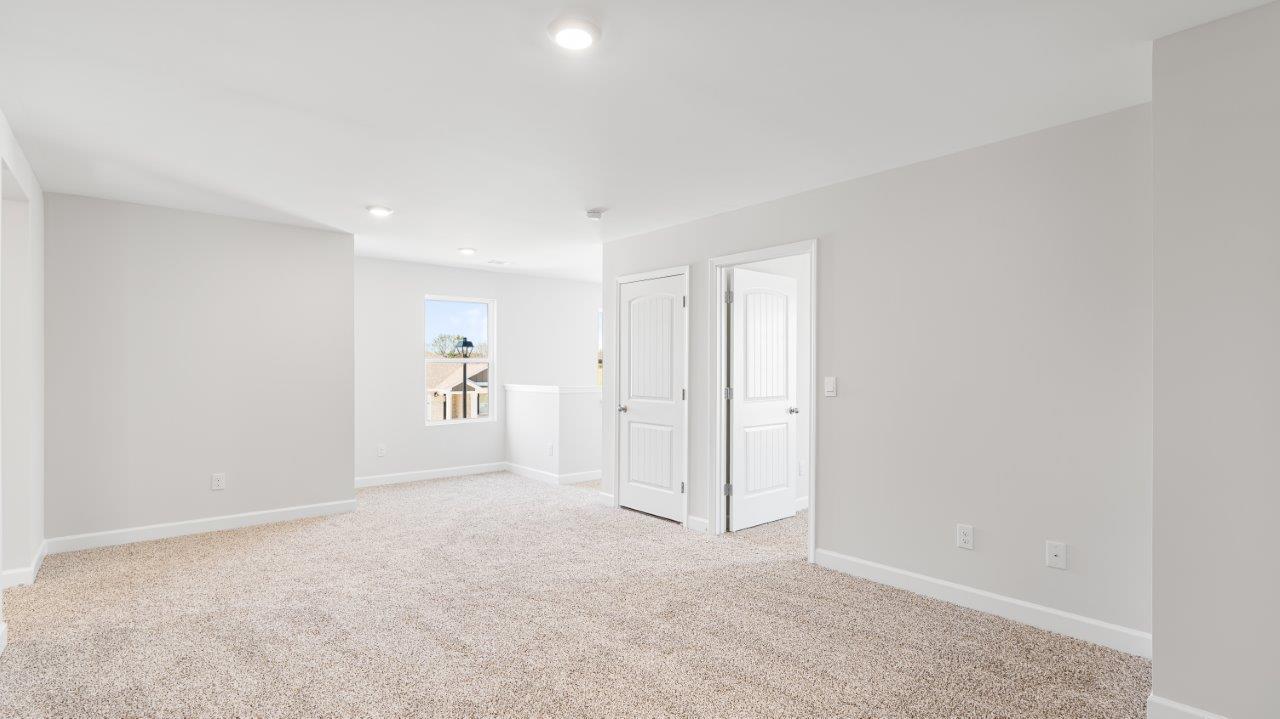 Belfort floorplan with quartz counter tops,, open concept living, and lvp flooring in all wet areas