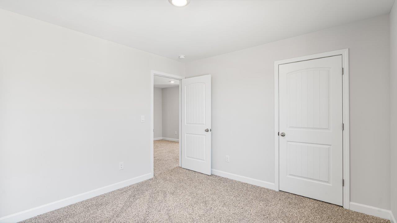 Belfort floorplan with quartz counter tops,, open concept living, and lvp flooring in all wet areas