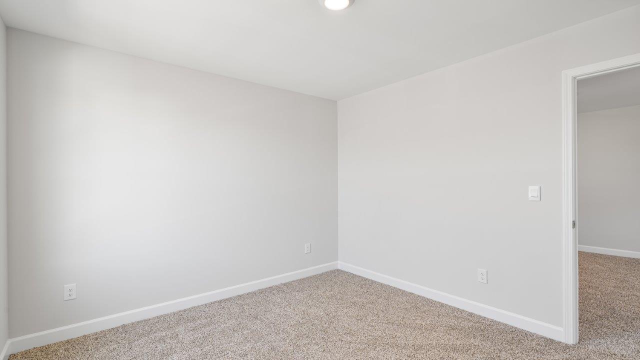 Belfort floorplan with quartz counter tops,, open concept living, and lvp flooring in all wet areas