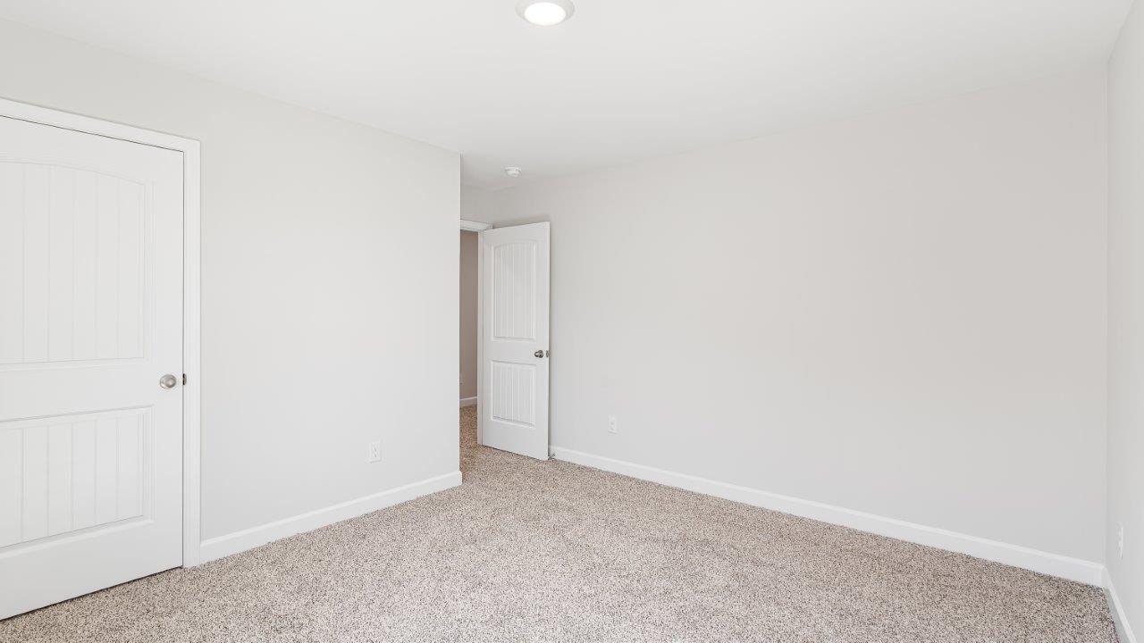 Belfort floorplan with quartz counter tops,, open concept living, and lvp flooring in all wet areas