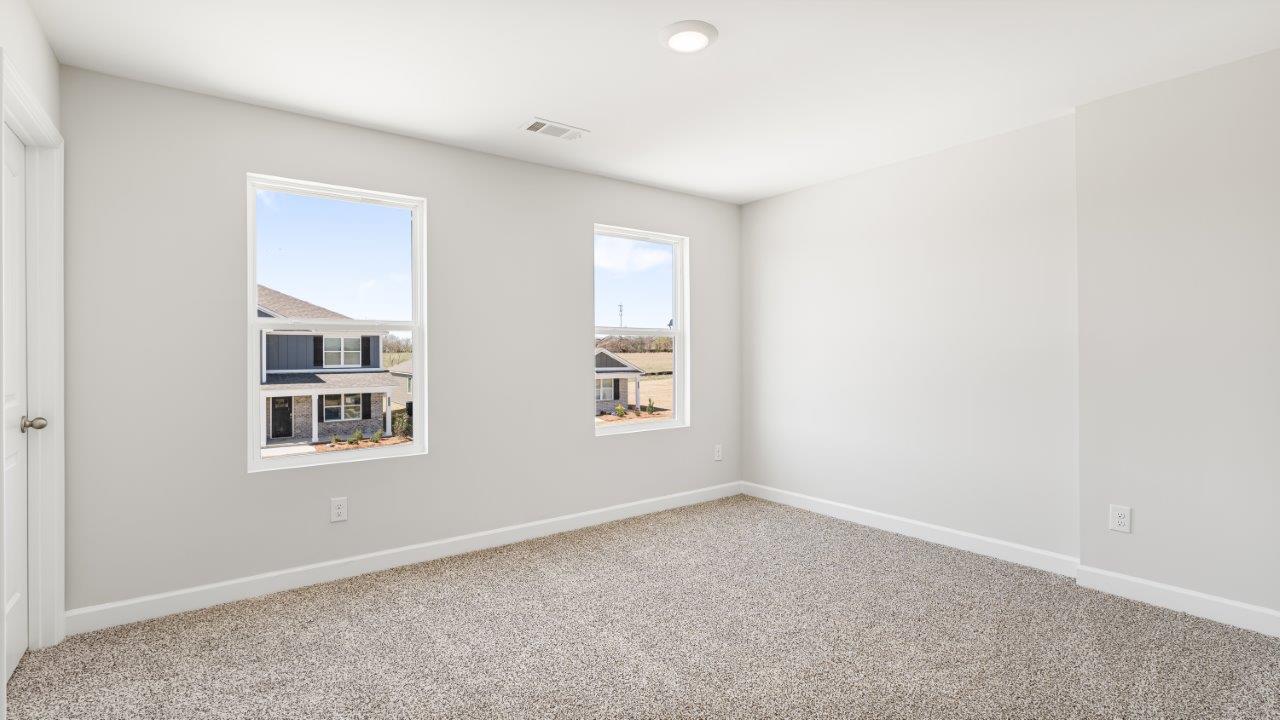 Belfort floorplan with quartz counter tops,, open concept living, and lvp flooring in all wet areas