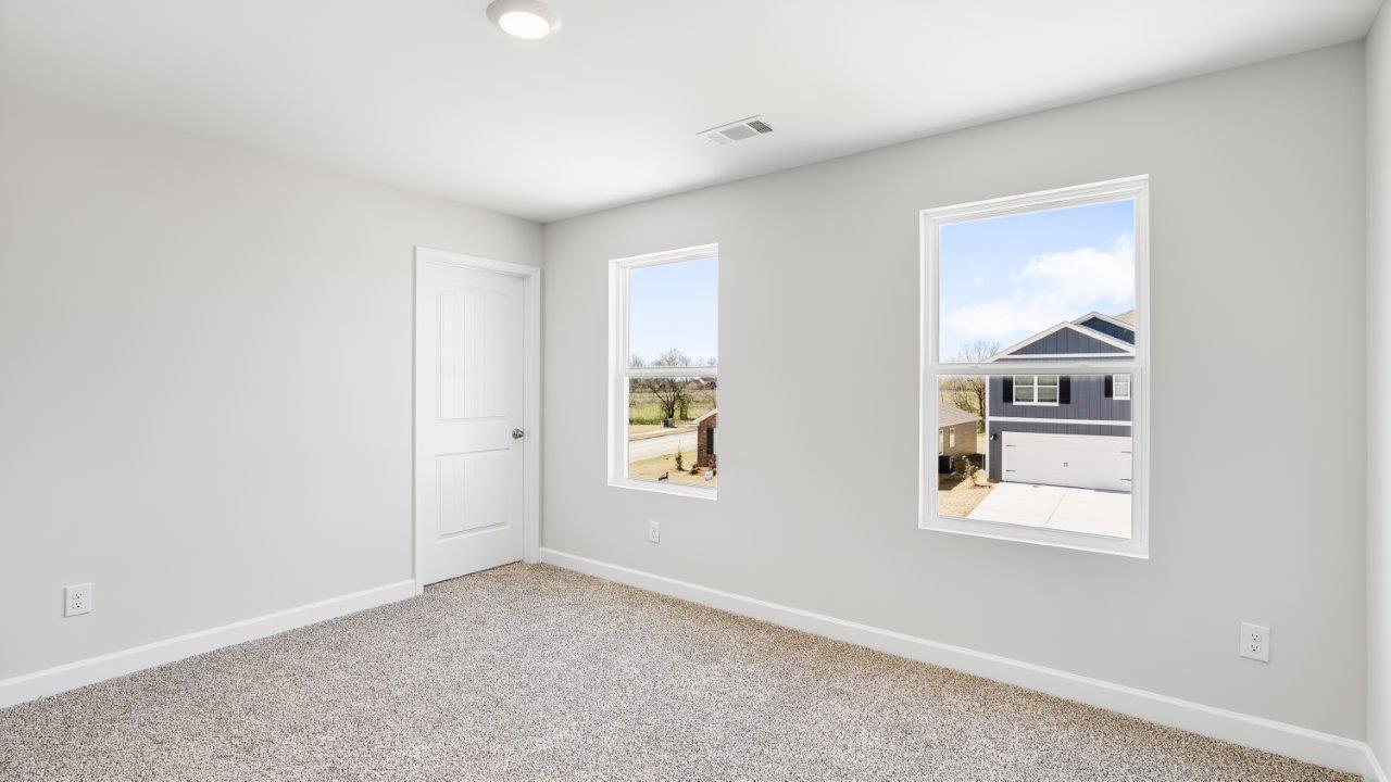 Belfort floorplan with quartz counter tops,, open concept living, and lvp flooring in all wet areas