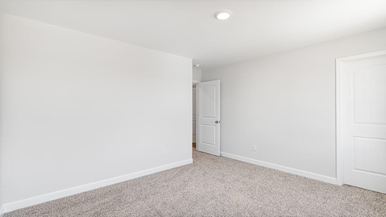 Belfort floorplan with quartz counter tops,, open concept living, and lvp flooring in all wet areas