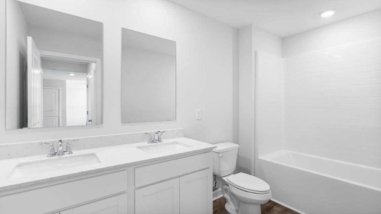 Belfort floorplan with quartz counter tops,, open concept living, and lvp flooring in all wet areas