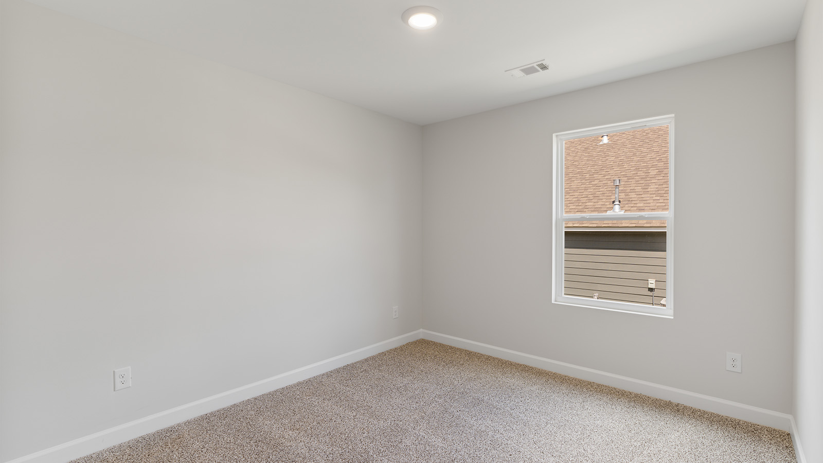 Interior photo of a bedroom in a freeport floorplan home.