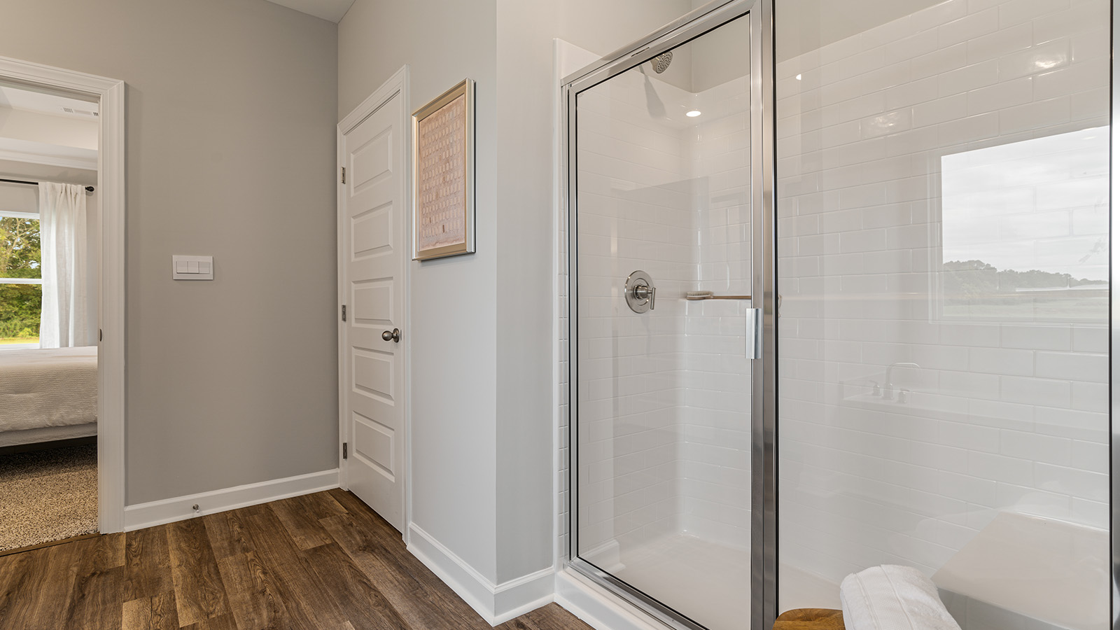 luxury vinyl plan flooring in bathrooms with quartz countertops