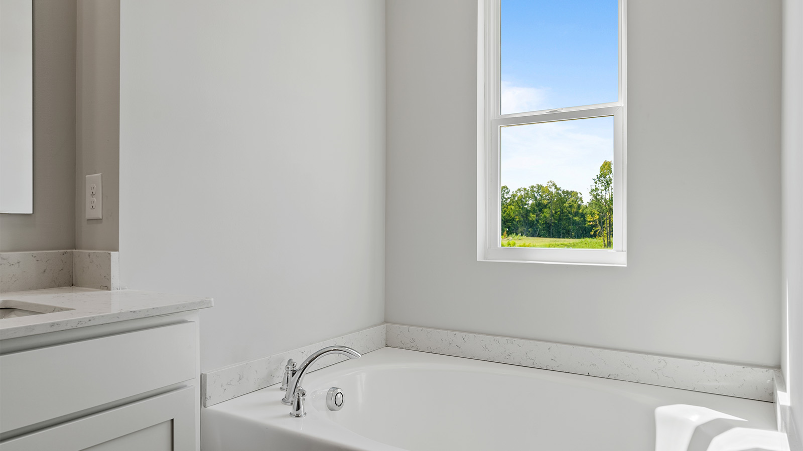 luxury vinyl plan flooring in bathrooms with quartz countertops