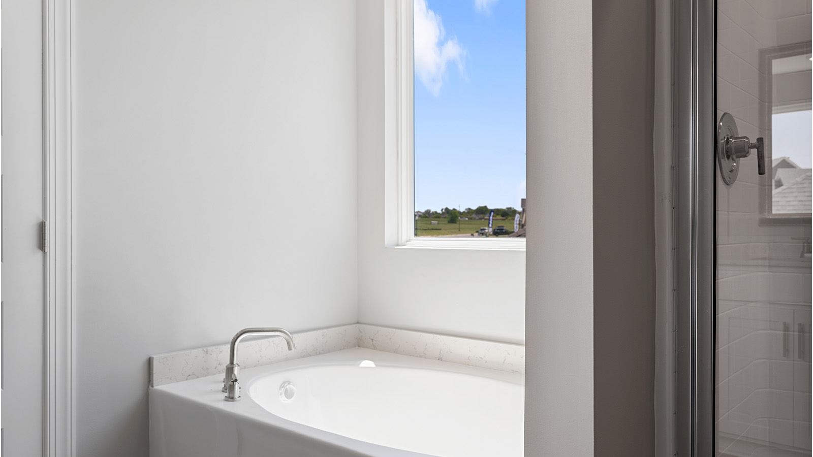 luxury vinyl plan flooring in bathrooms with quartz countertops