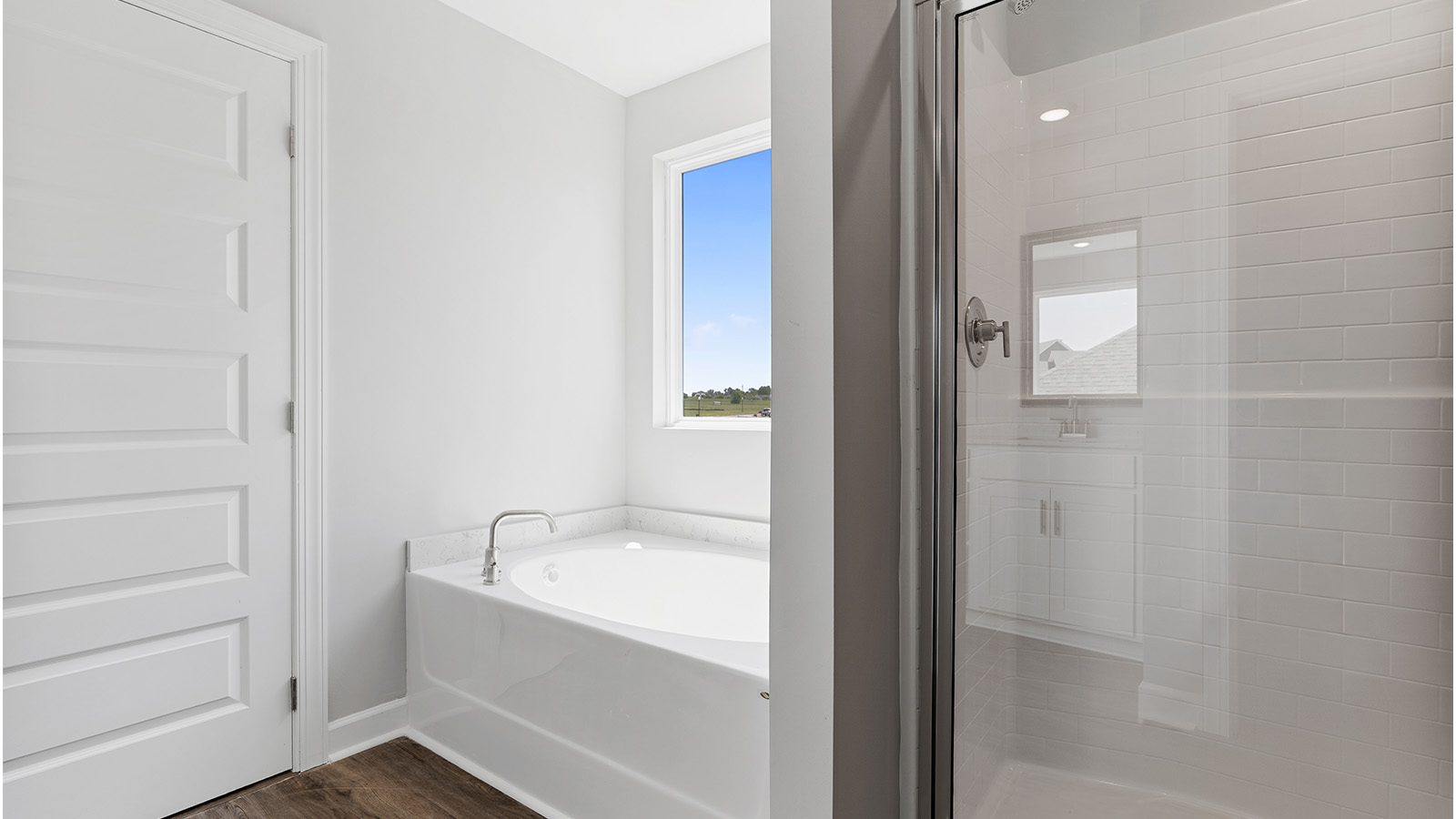 luxury vinyl plan flooring in bathrooms with quartz countertops