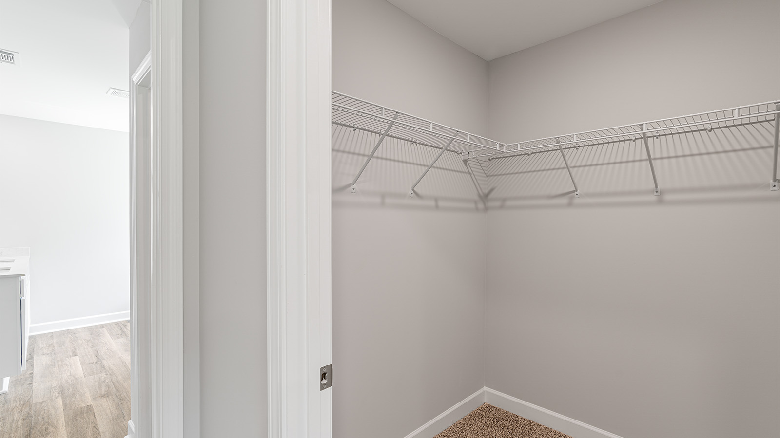 luxury vinyl plan flooring in bathrooms with quartz countertops