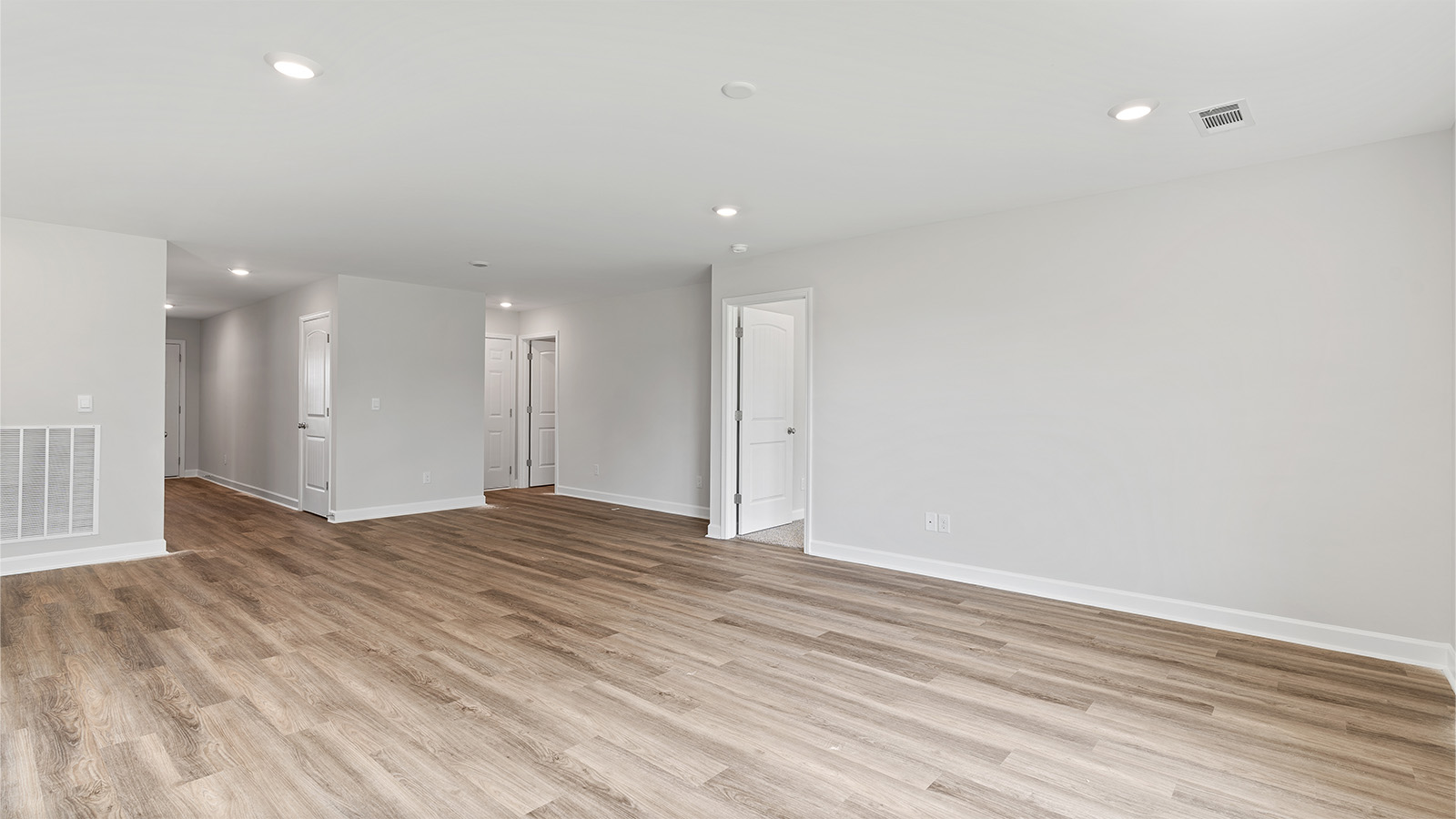Seamless kitchen to living flow with luxury vinyl plank floors
