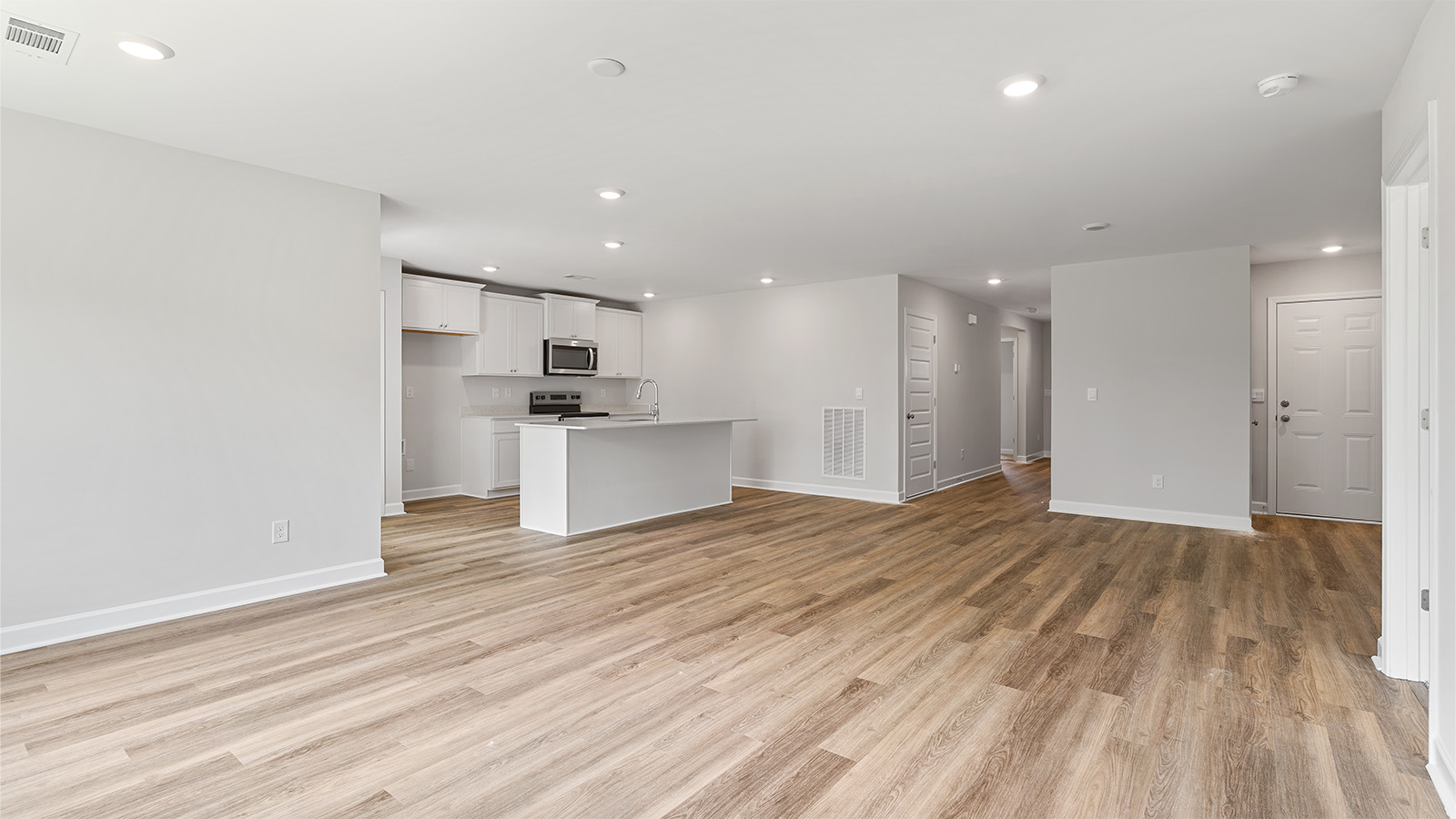 Seamless kitchen to living flow with luxury vinyl plank floors