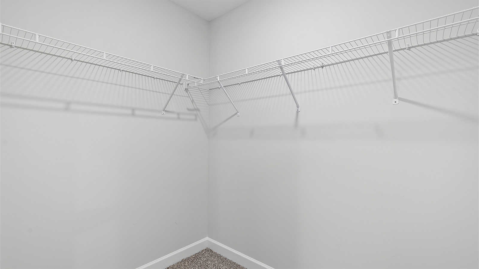Spacious laundry area with durable LVP flooring and storage options