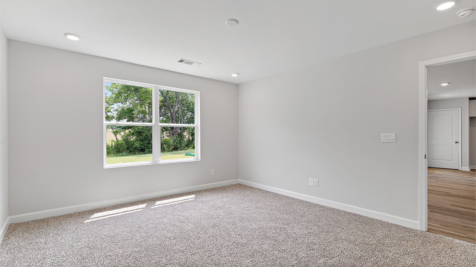 Large primary suite with walk in closet and private bath
