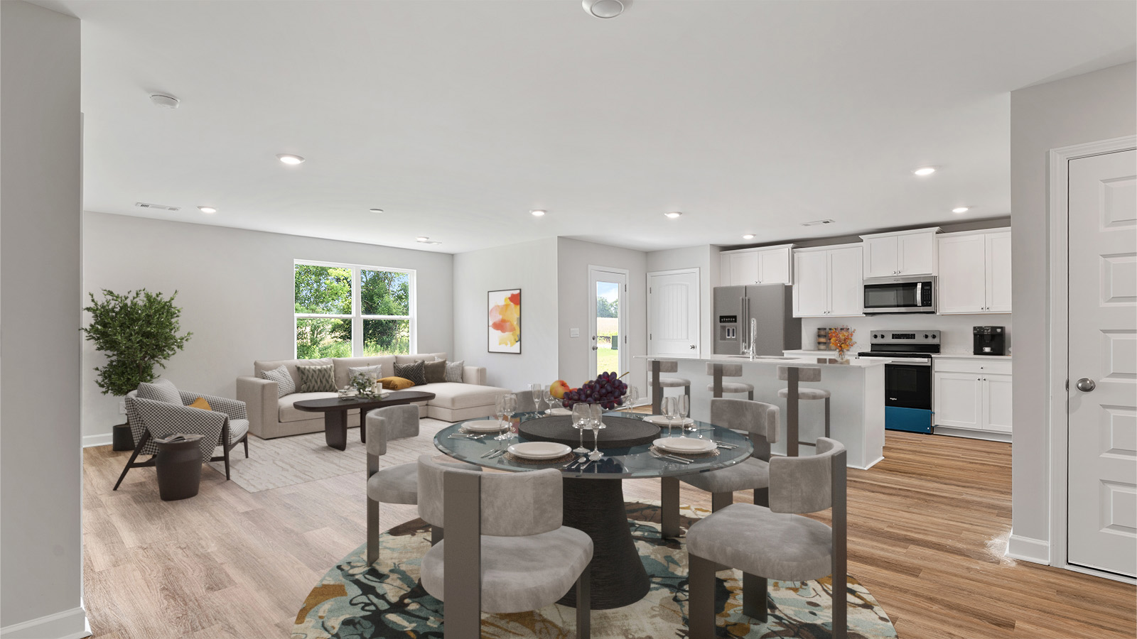 Seamless kitchen to living flow with luxury vinyl plank floors