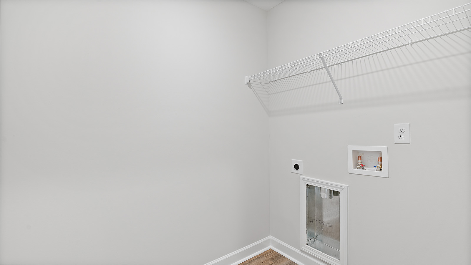 laundry room with luxury vinyl plank flooring