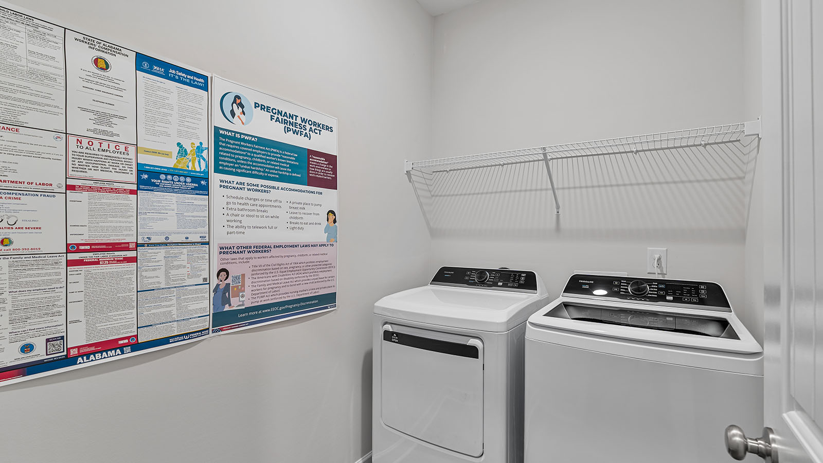 Practical laundry area designed with LVP and ample utility space.