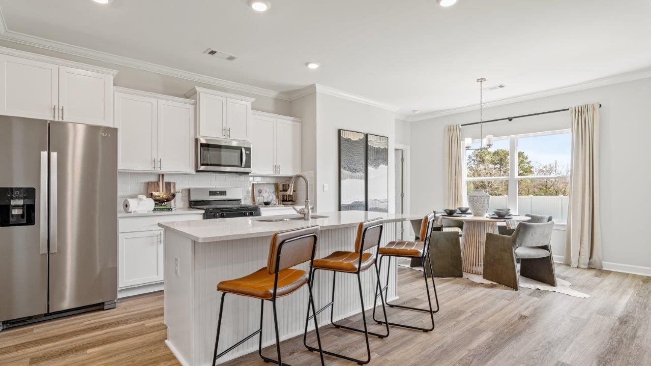 Avery floorplan dining space in Willow Point community Open‑concept Avery kitchen design by D.R. Horton