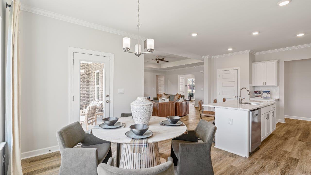Avery floorplan dining space in Willow Point community Open‑concept Avery kitchen design by D.R. Horton