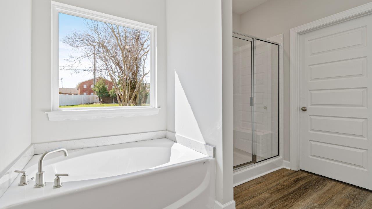 Avery floorplan space in Willow Point community owner’s bath with double vanity in Willow Point