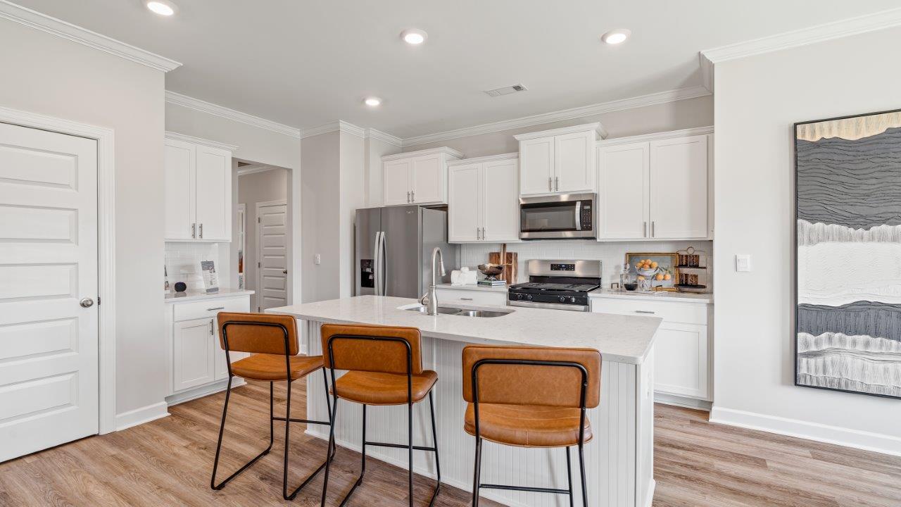 Avery floorplan dining space in Willow Point community Open‑concept Avery kitchen design by D.R. Horton