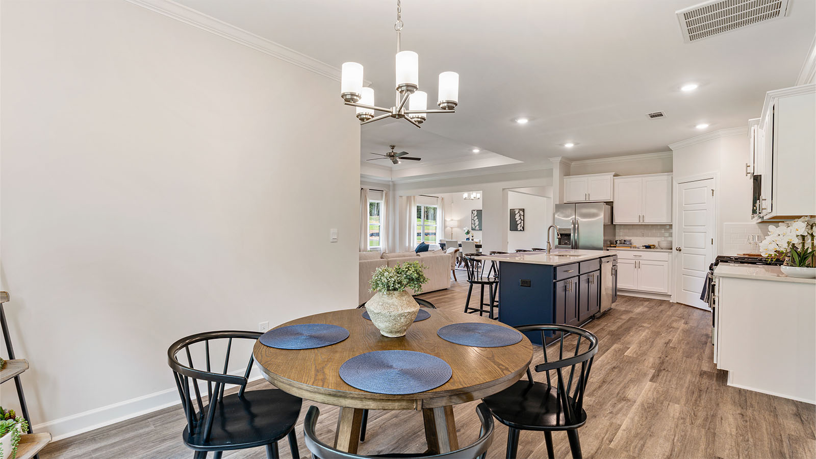The Camden floorplan kitchen with quartz countertops, soft close cabinets, and LVP flooring