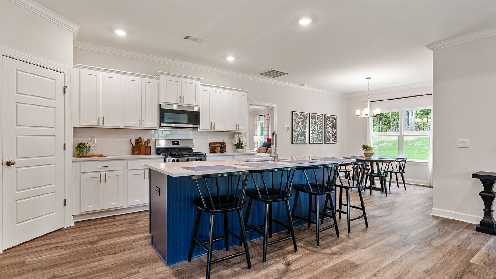 The Camden floorplan kitchen with quartz countertops, soft close cabinets, and LVP flooring