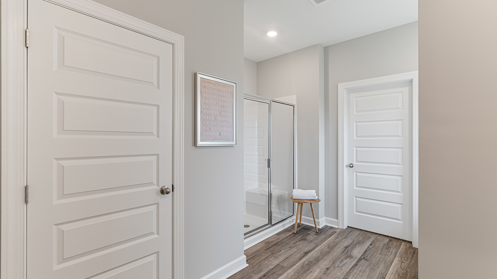 luxury vinyl plan flooring in bathrooms with quartz countertops