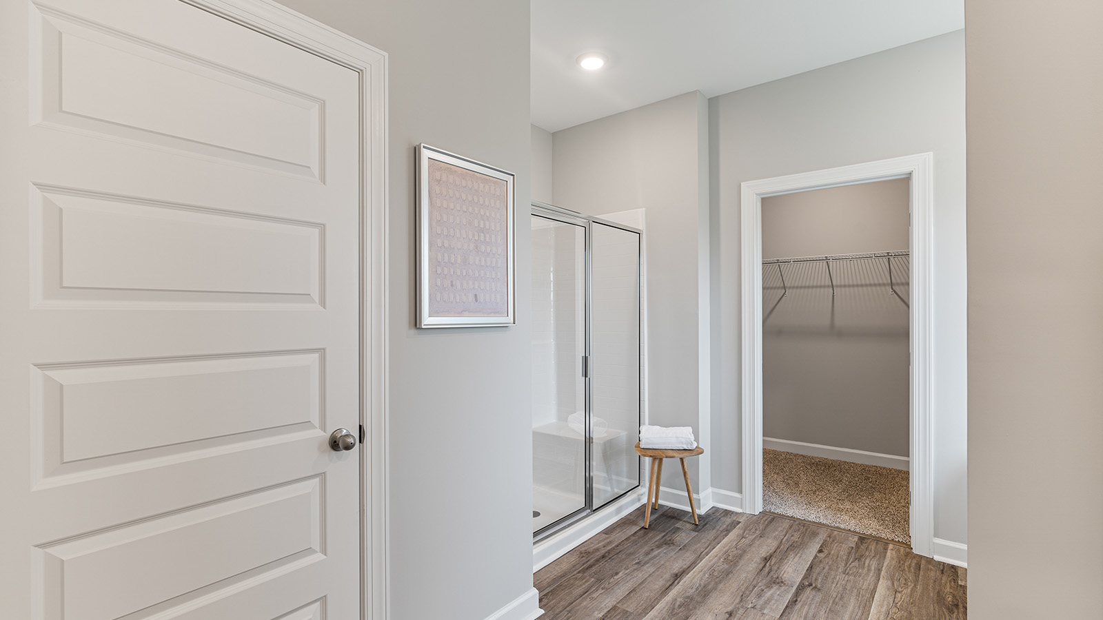 luxury vinyl plan flooring in bathrooms with quartz countertops
