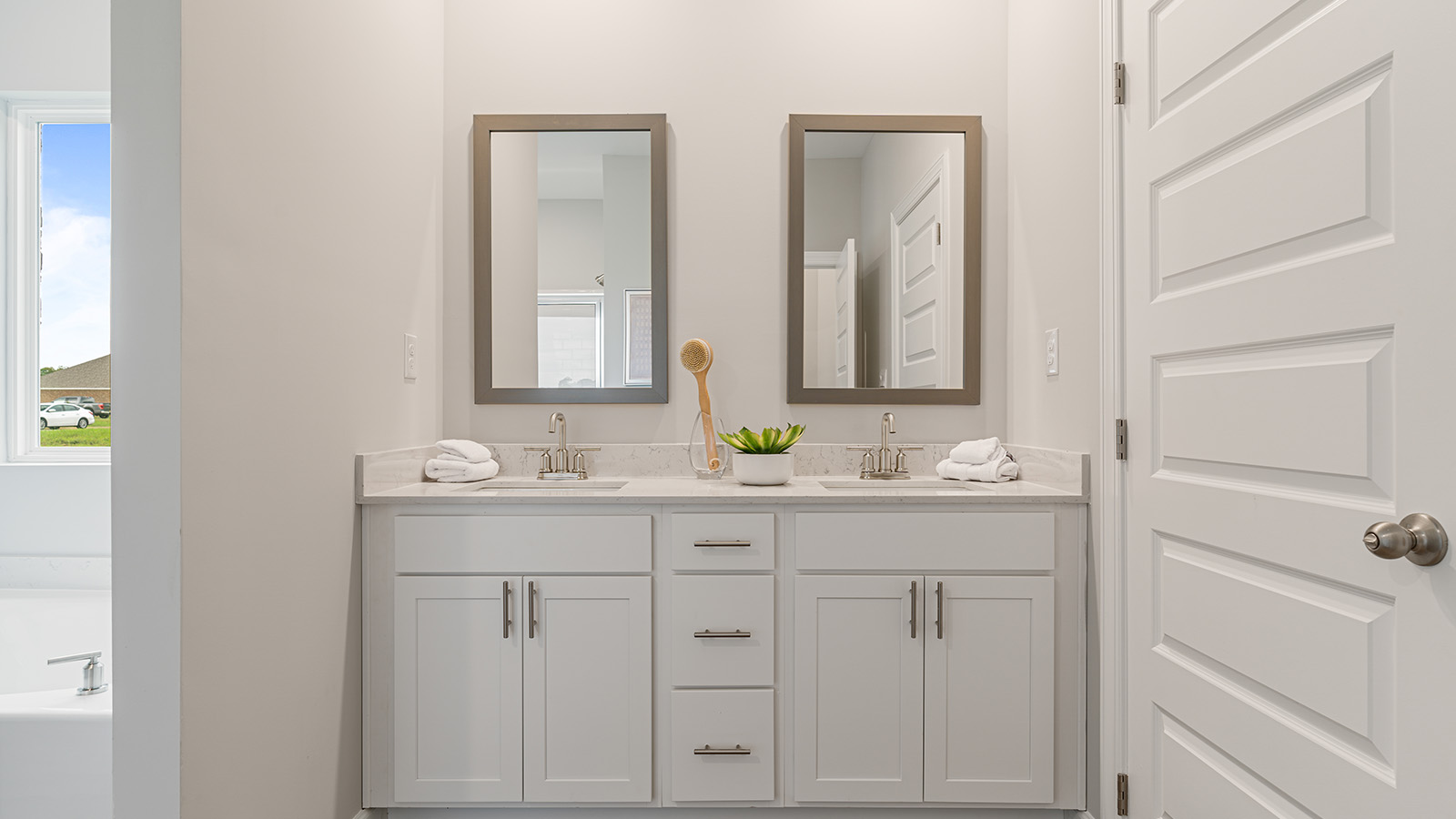 luxury vinyl plan flooring in bathrooms with quartz countertops