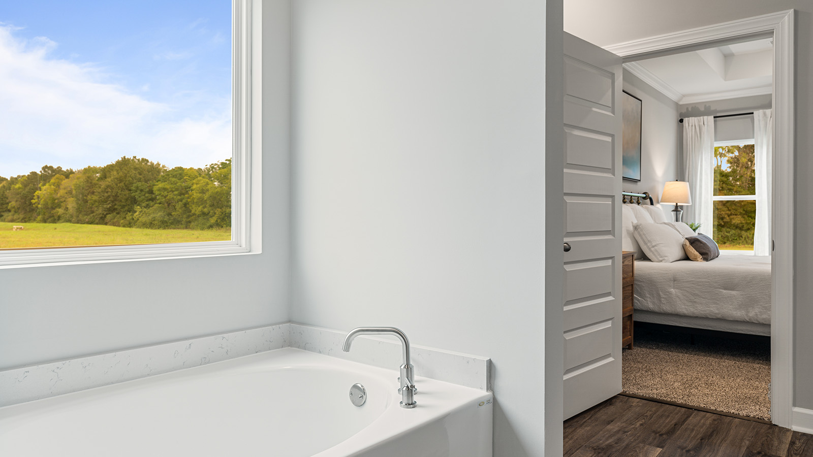 luxury vinyl plan flooring in bathrooms with quartz countertops