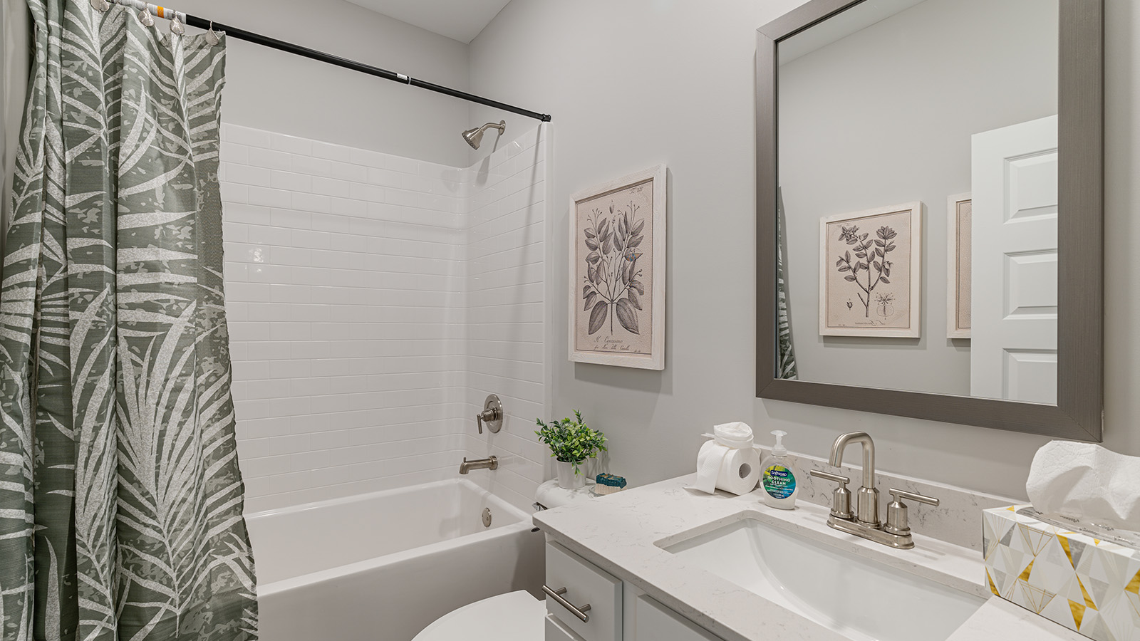 luxury vinyl plan flooring in bathrooms with quartz countertops