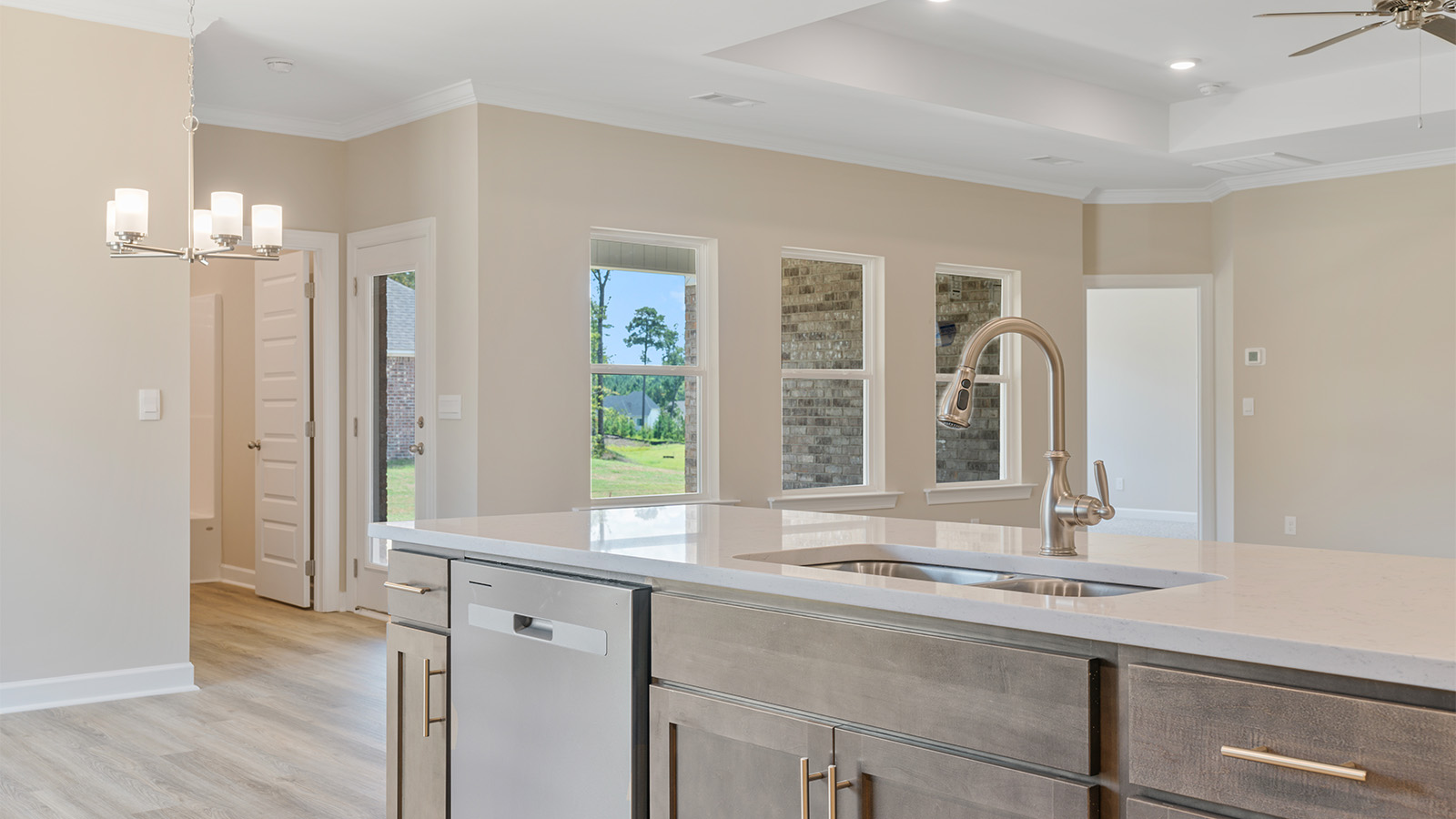 Open kitchen with island and quartz counter tops