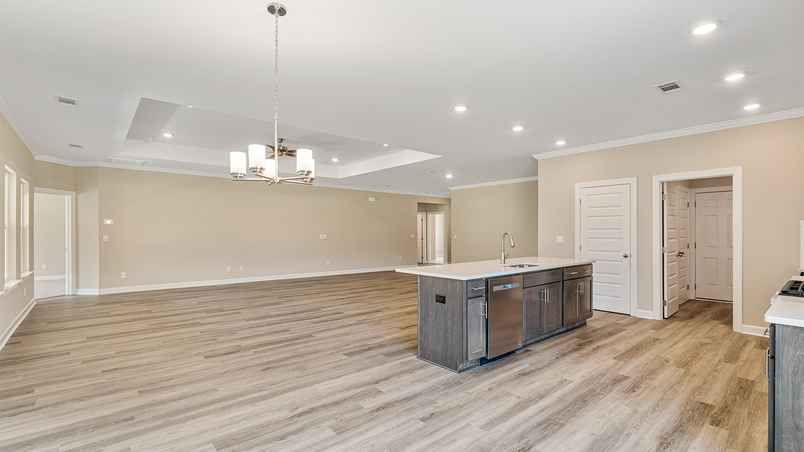 Open kitchen with island and quartz counter tops