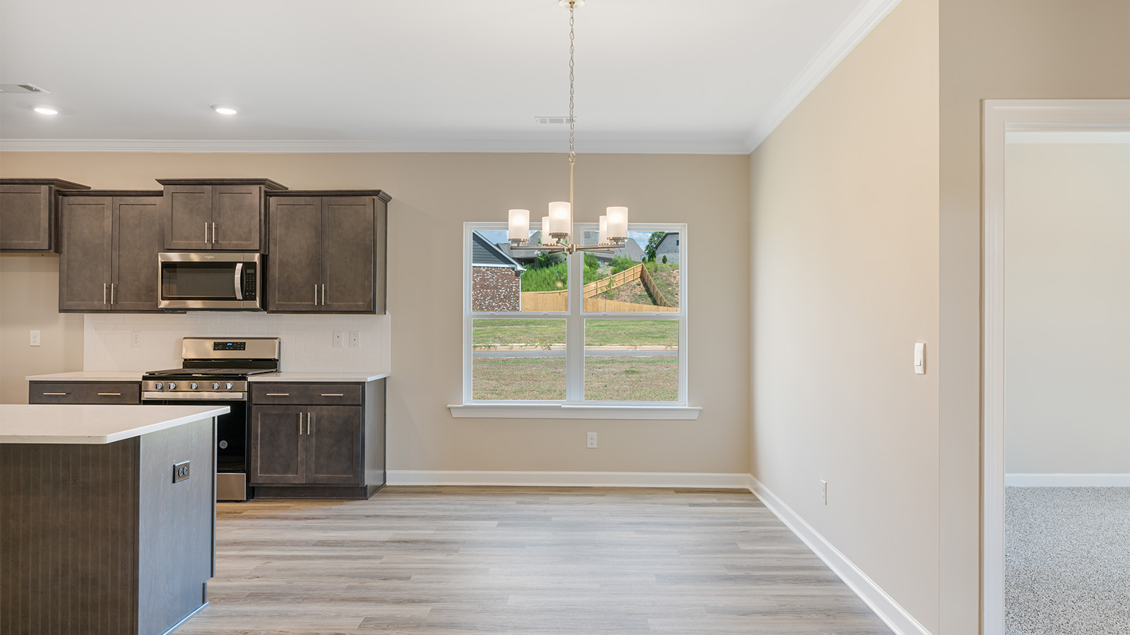 Open kitchen with island and quartz counter tops