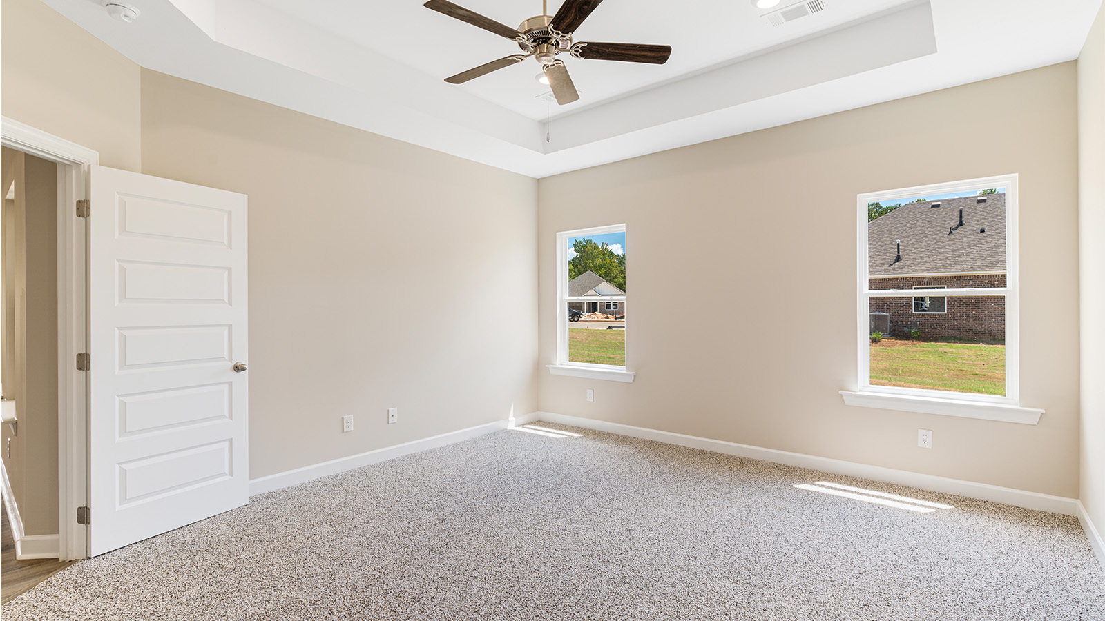 Bedroom with carpet and a ceiling fan