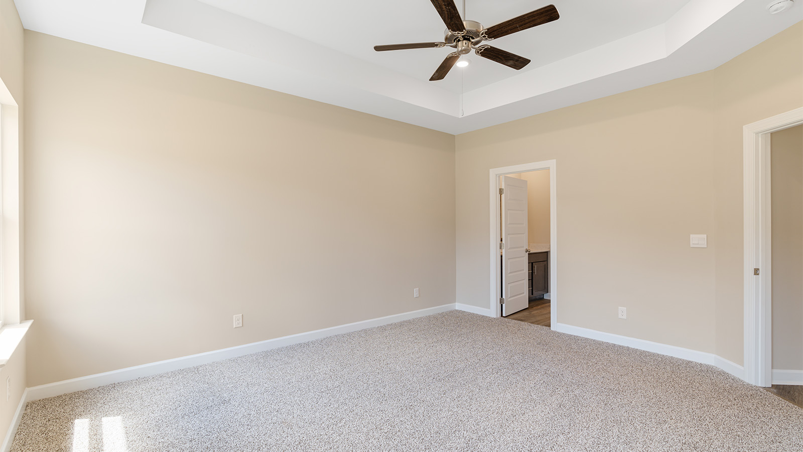 Bedroom with carpet and a ceiling fan