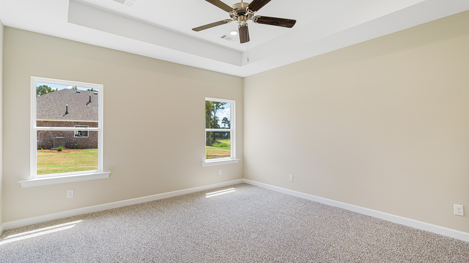 Bedroom with carpet and a ceiling fan