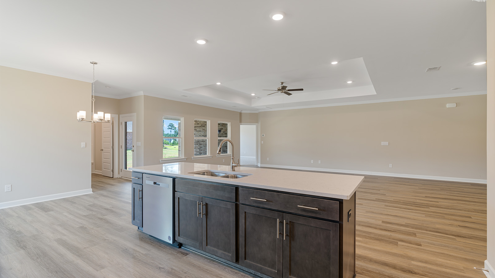Open kitchen with island and quartz counter tops