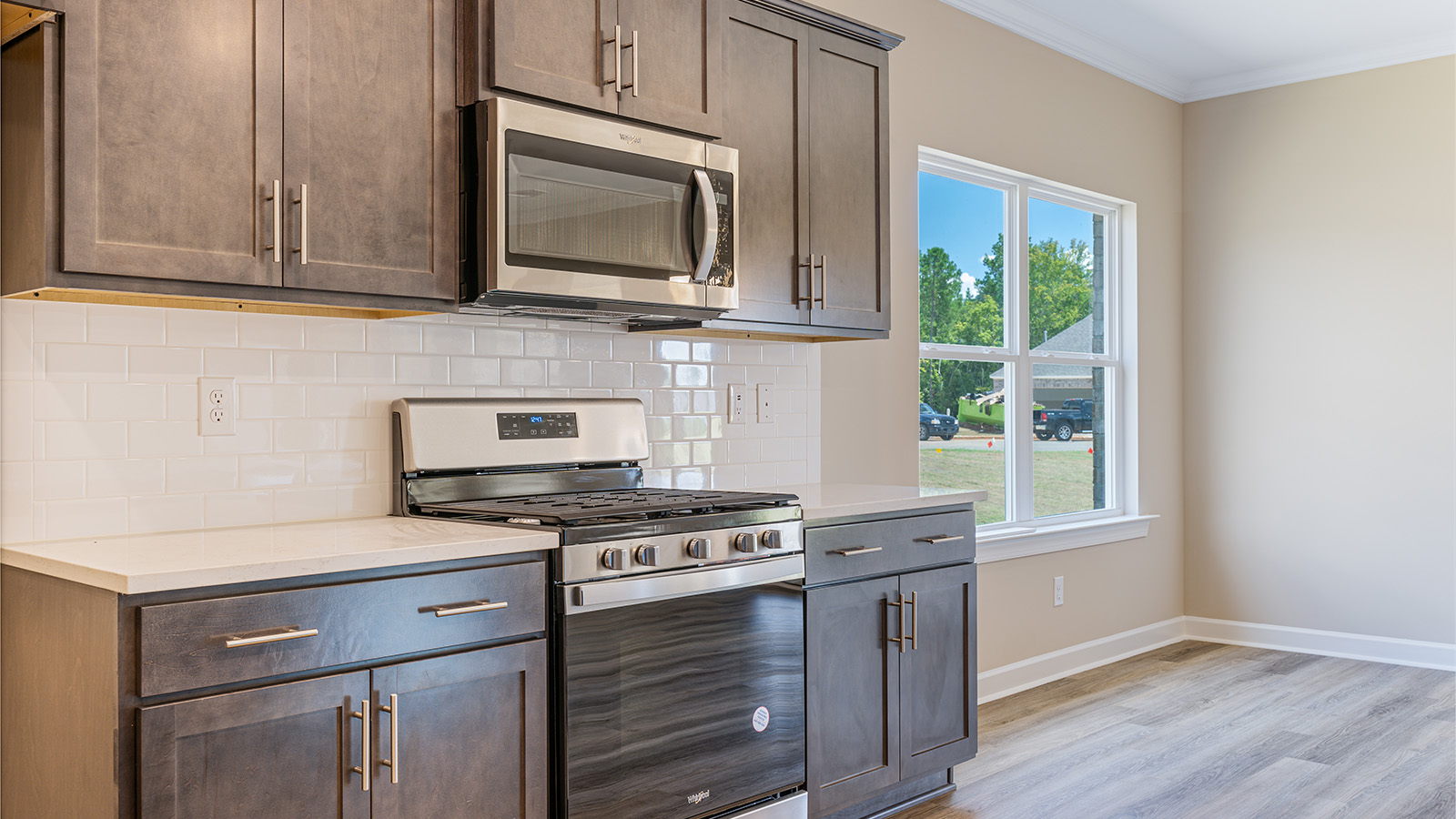 Open kitchen with island and quartz counter tops
